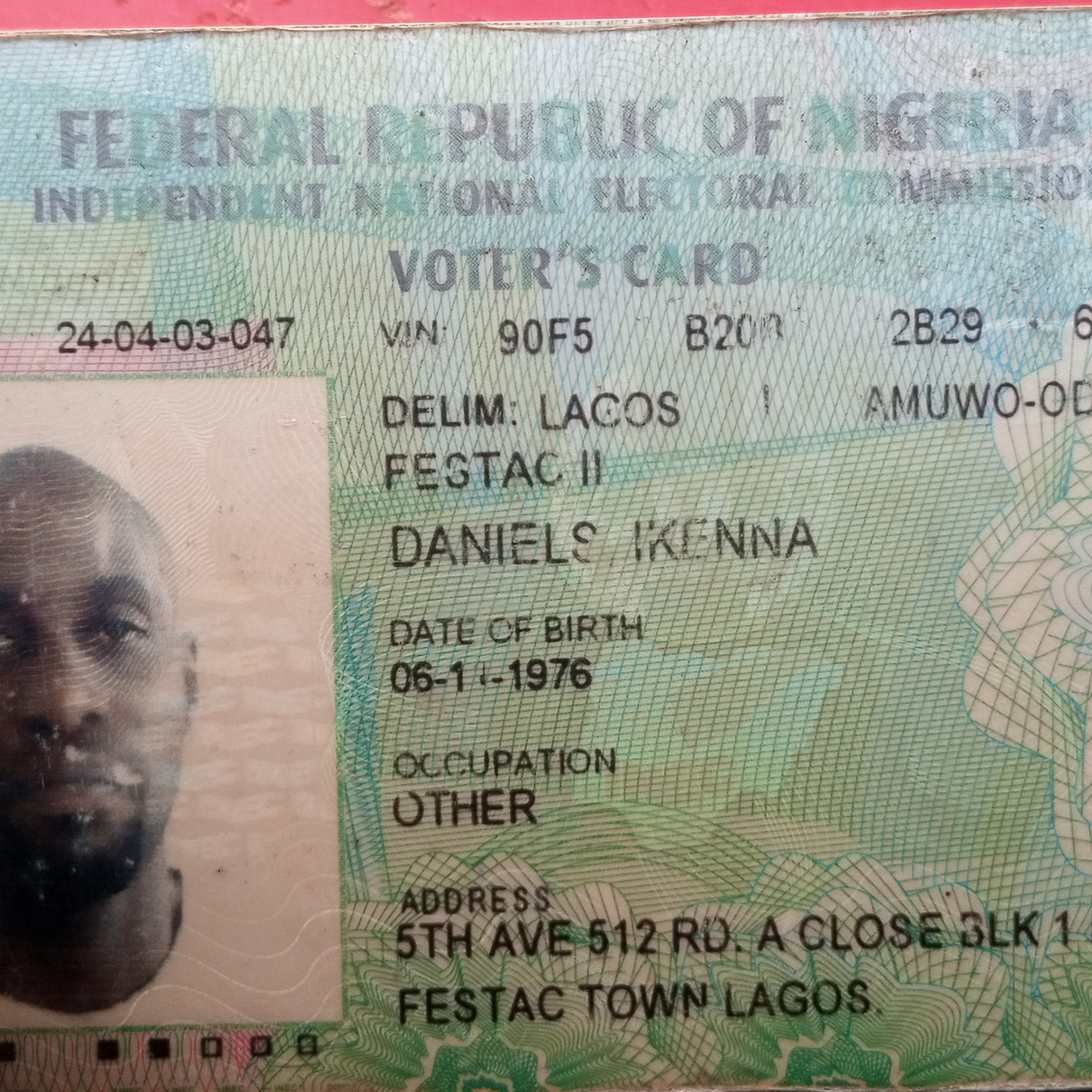 Yusuf's ID, a Nigerian Voter's Card, containing his name (the same name on his new email address, which I believe is his real name), listing his date of birth as 6th of November 1976 (or maybe 11th of June 1976) and showing the face of a forlorn-looking jet-black man, average weight, bald with a short beard, staring into the camera. And his address at 5th Avenue, 512 Rd., A Close, Block 1, in Festac Town, Lagos, corresponding to the Moneygram receiver information which he had provided to Jeb. So, a real ID, with his real name, photo, and address.